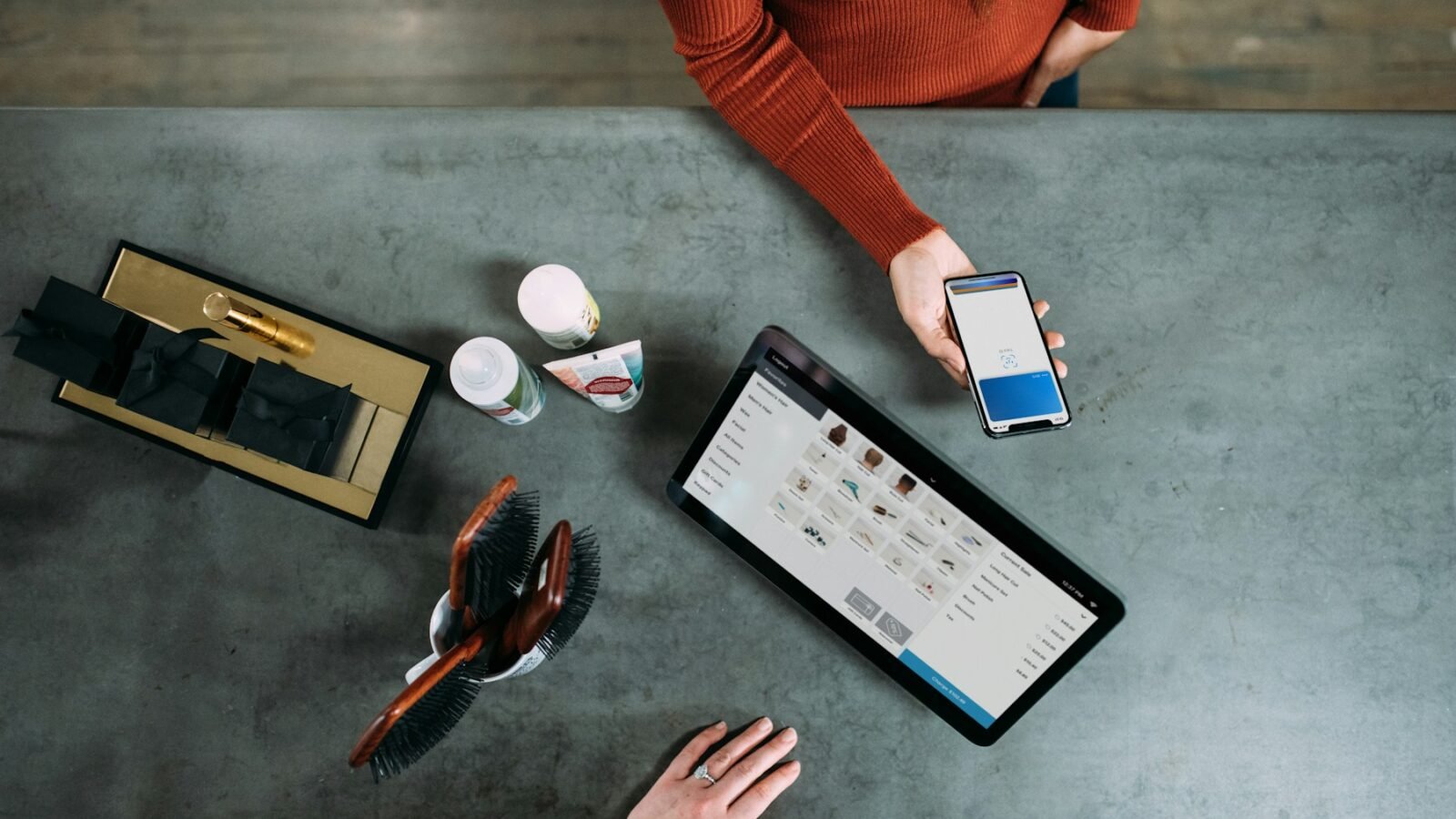 Freelancer reviewing a digital payment on a smartphone at a work desk